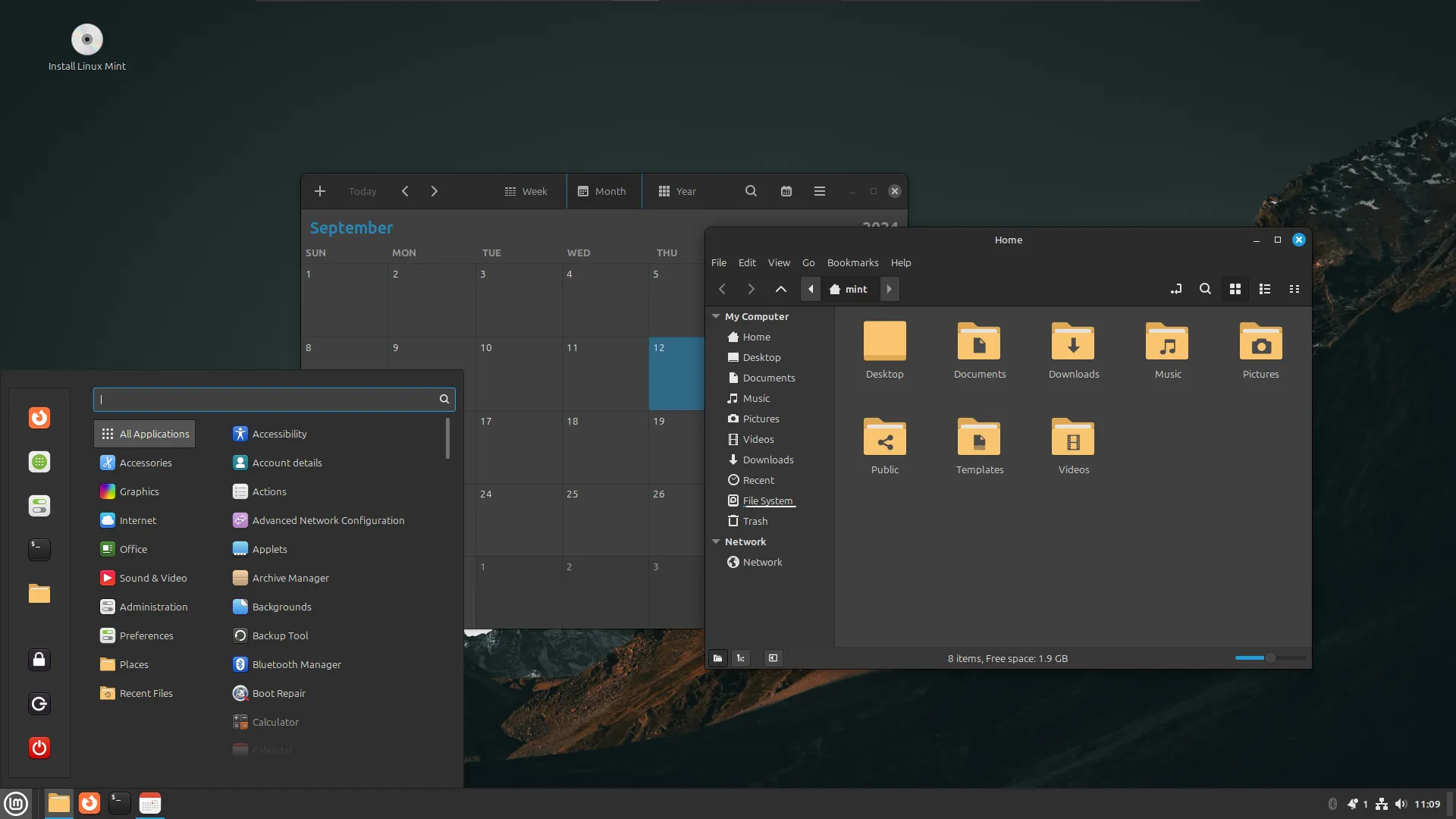 Màn hình desktop của Linux Mint với cửa sổ trình duyệt tệp và ứng dụng lịch mở