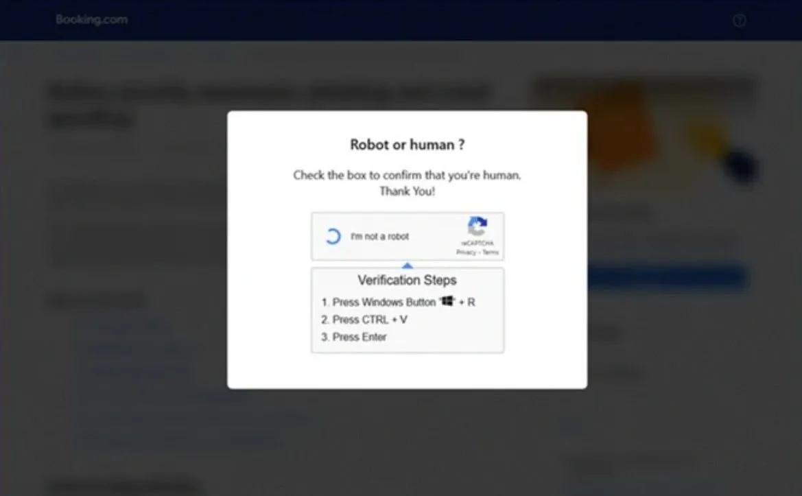 Ví dụ trang xác thực CAPTCHA giả mạo dùng để lừa đảo người dùng Booking.com chạy lệnh độc hại